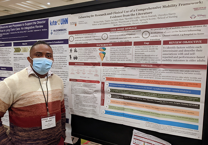 Michael Kalu with a poster at CAG 2022