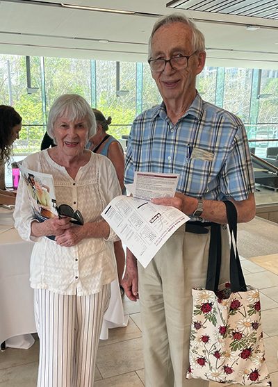 Two older adults attend the research fair