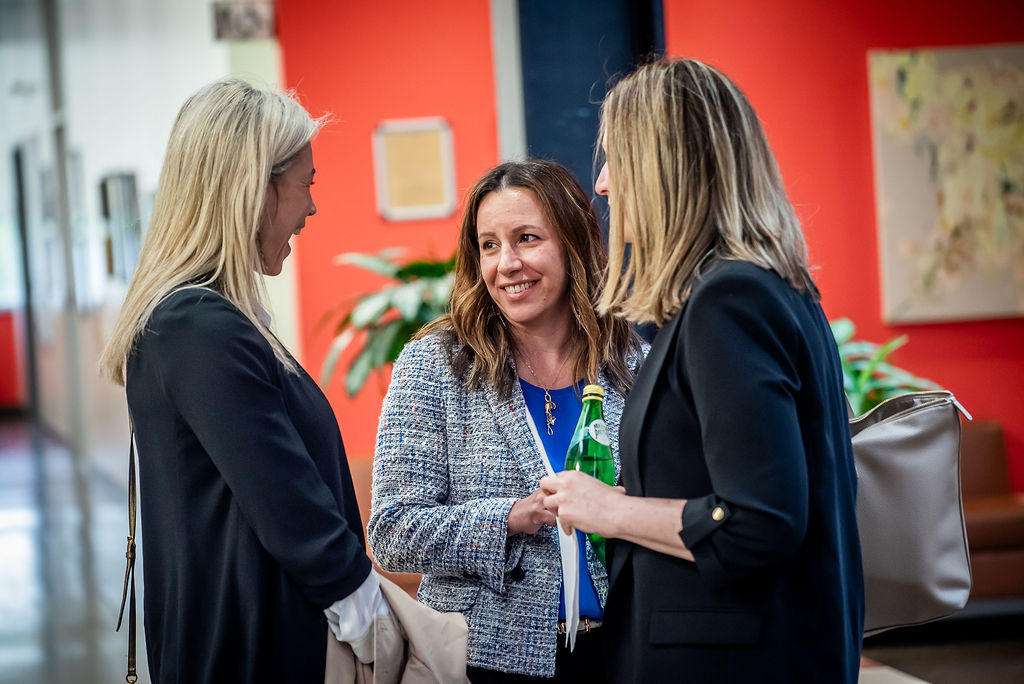 Jennifer Heisz, Luciana Macedo and Marla Beauchamp talk to each other