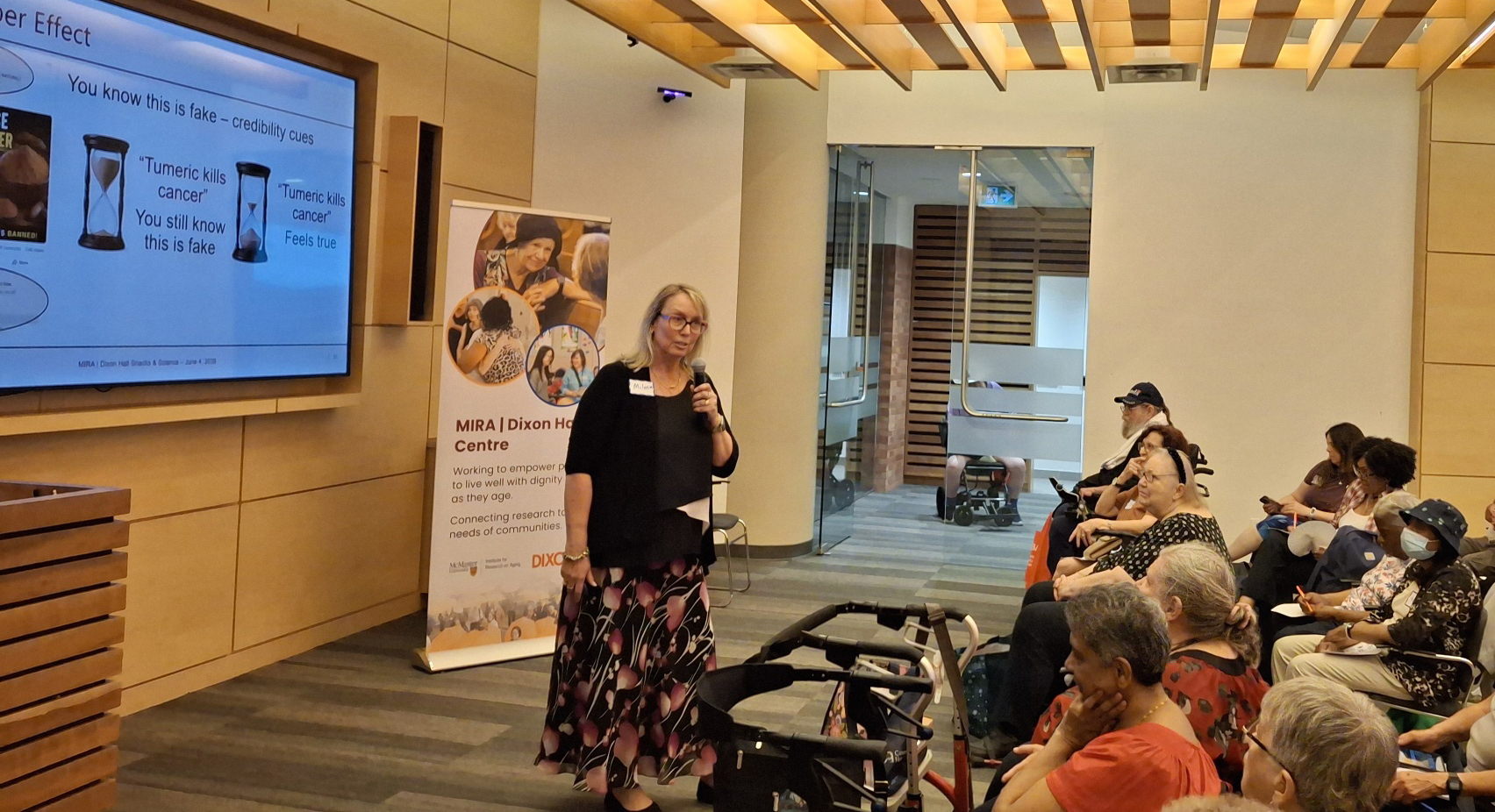 Milena Head speaks to a group of people